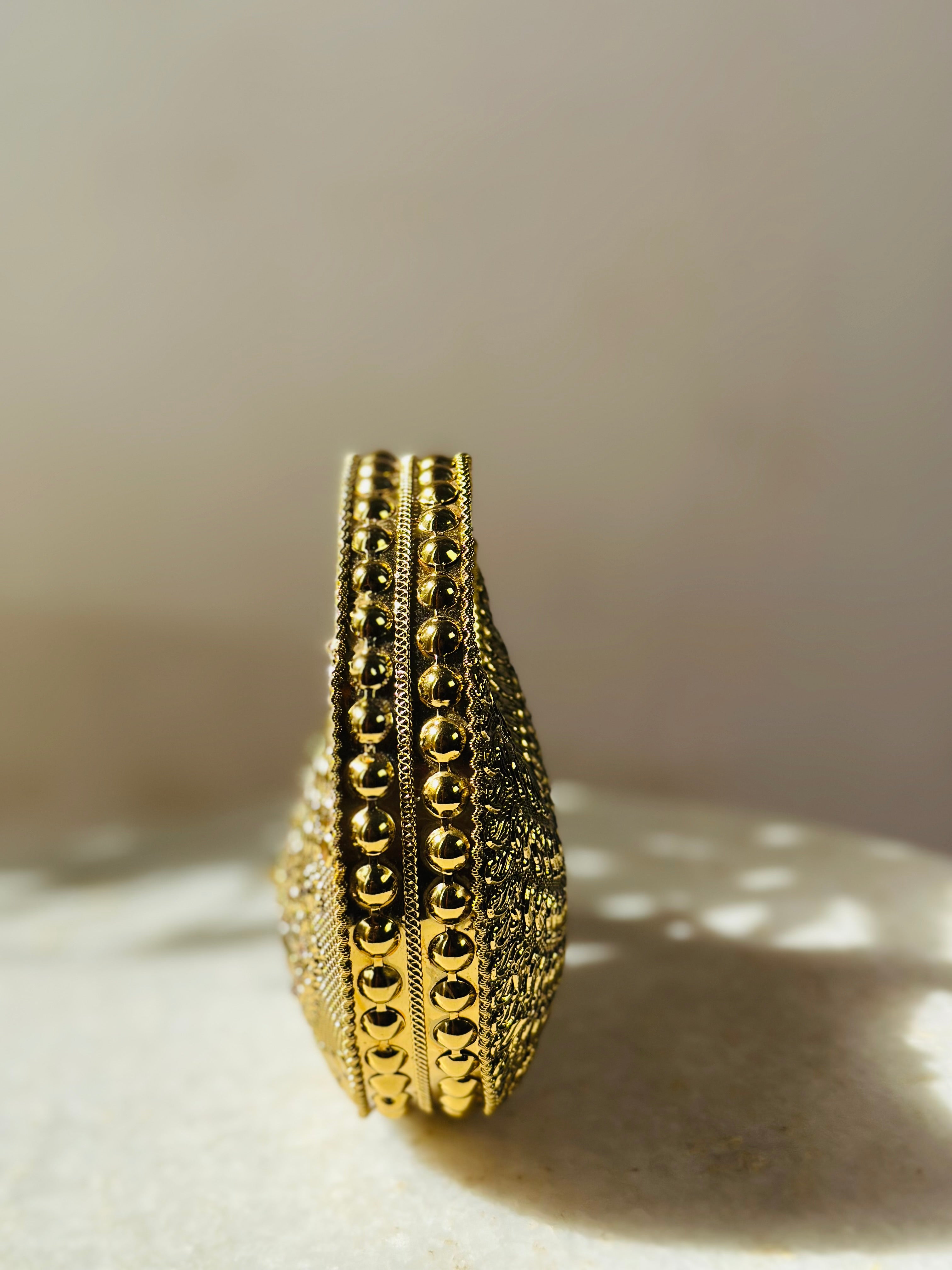 Durga Metal clutch